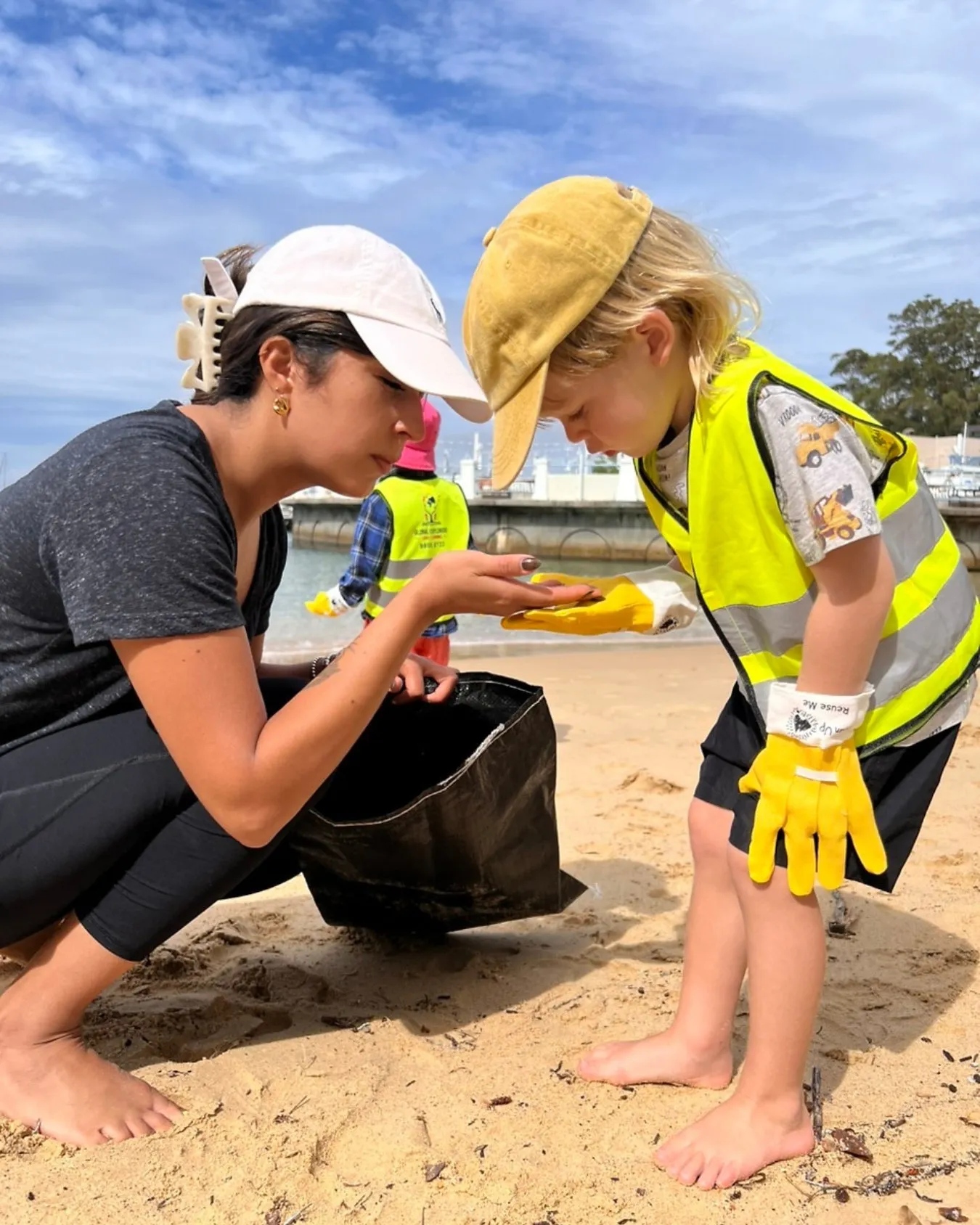 A Global Explorers child taking part in a beach clean-up